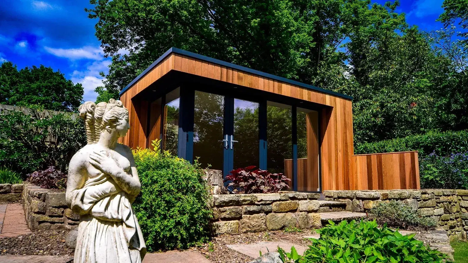 Modern garden room exterior with full-height glazing